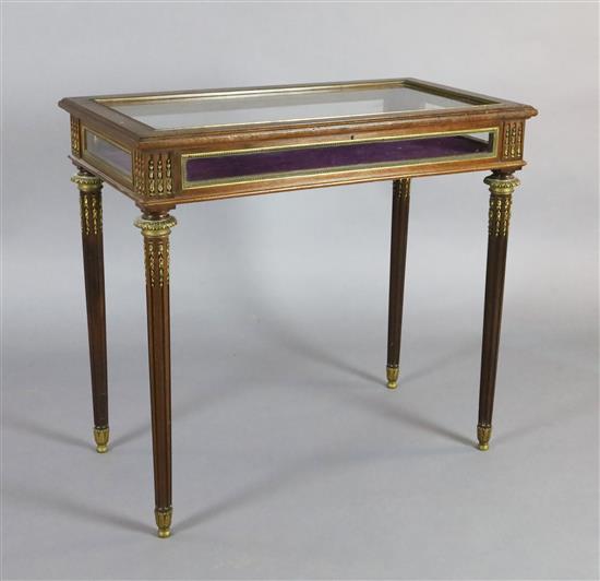 An early 20th century French ormolu mounted mahogany display table, W.2ft 9in. D.1ft 6in. H.2ft 6in.